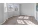 Sun-filled kitchen nook with large windows and luxury vinyl flooring perfect for enjoying morning coffee at 307 Gordon St, Roxboro, NC 27573
