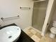 Bathroom with a glass shower, granite countertop, and modern fixtures at 318 N Estes Dr, Chapel Hill, NC 27514
