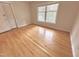 Bedroom with natural lighting and hardwood floors and a single window at 318 N Estes Dr, Chapel Hill, NC 27514
