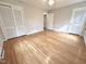 Spacious bedroom with hardwood floors, closet, and natural light at 318 N Estes Dr, Chapel Hill, NC 27514