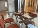 Dining area featuring a glass table, seating for five, and bright light at 318 N Estes Dr, Chapel Hill, NC 27514