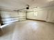 Clean and spacious two-car garage with an epoxy floor, offering ample storage and parking space at 318 N Estes Dr, Chapel Hill, NC 27514