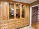 Kitchen featuring ample cabinet space with glass doors, granite countertops, and travertine tile at 318 N Estes Dr, Chapel Hill, NC 27514