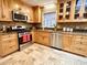 Updated kitchen with stainless steel appliances, custom cabinets, and tiled backsplash at 318 N Estes Dr, Chapel Hill, NC 27514