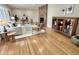 Spacious living room with hardwood floors, a brick fireplace, and elegant furniture at 318 N Estes Dr, Chapel Hill, NC 27514