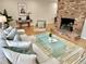 Inviting living room with brick fireplace, comfortable seating, and stylish decor at 318 N Estes Dr, Chapel Hill, NC 27514