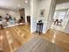 Bright living room featuring hardwood floors, a brick fireplace, and stylish furnishings at 318 N Estes Dr, Chapel Hill, NC 27514