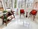 Cozy sunroom featuring lots of natural light and stylish furniture at 318 N Estes Dr, Chapel Hill, NC 27514