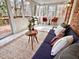 Cozy sunroom featuring lots of natural light, stylish furniture, and brick walls at 318 N Estes Dr, Chapel Hill, NC 27514