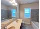 Bathroom featuring a double vanity, tile floors, and soaking tub at 318 S Bend Dr, Durham, NC 27713