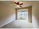Comfortable bedroom with neutral carpet, bay window, and ceiling fan at 318 S Bend Dr, Durham, NC 27713