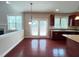 Bright breakfast nook with hardwood floors and access to the kitchen and outdoor patio at 318 S Bend Dr, Durham, NC 27713
