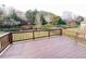 Spacious wooden deck offers beautiful views of the surrounding landscape and greenery at 318 S Bend Dr, Durham, NC 27713