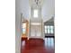 Bright foyer with high ceilings, hardwood floors, and double doors leading to the outside at 318 S Bend Dr, Durham, NC 27713