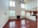 Spacious living room with high ceilings, fireplace, hardwood floors, and lots of natural light at 318 S Bend Dr, Durham, NC 27713