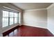 Cozy living room with hardwood floors, a large window, and neutral paint at 318 S Bend Dr, Durham, NC 27713