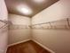 Walk-in closet with shelving and carpet at 318 S Bend Dr, Durham, NC 27713