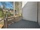 View of wood deck overlooking treed backyard and siding of home at 3213 Coachmans Way, Durham, NC 27705
