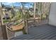 Wood deck with stairs to backyard and view of wooded scenery and neighboring townhomes at 3213 Coachmans Way, Durham, NC 27705
