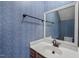 Bathroom featuring a vanity with a granite countertop and decorative wallpaper at 3213 Coachmans Way, Durham, NC 27705