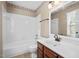 Bathroom with a tiled shower-tub combination, toilet, and a classic vanity at 3213 Coachmans Way, Durham, NC 27705