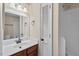 Well-kept bathroom featuring a tiled shower-tub and a classic vanity at 3213 Coachmans Way, Durham, NC 27705