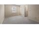 Spacious bedroom with neutral carpet and multiple doorways allowing ample access at 3213 Coachmans Way, Durham, NC 27705