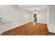 Bright dining room with hardwood floors and a view into the kitchen at 3213 Coachmans Way, Durham, NC 27705