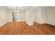 Open-concept dining area featuring hardwood floors and convenient access to the kitchen at 3213 Coachmans Way, Durham, NC 27705