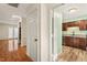 Inviting foyer with hardwood floors leading to the kitchen with stainless appliances at 3213 Coachmans Way, Durham, NC 27705