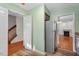 Kitchen area showcasing stainless steel refrigerator and view to living room at 3213 Coachmans Way, Durham, NC 27705