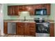 This kitchen features stainless appliances, granite counters, and wooden cabinets at 3213 Coachmans Way, Durham, NC 27705