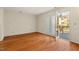 Well-lit living area with hardwood floors, fireplace and sliding glass doors at 3213 Coachmans Way, Durham, NC 27705