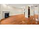 Open living space featuring hardwood floors, a fireplace, and a dining area at 3213 Coachmans Way, Durham, NC 27705