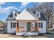 Charming two-story home featuring a cozy front porch with wooden pillars and dark shutters at 328 Cleveland St, Rocky Mount, NC 27803