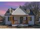 Inviting two-story home with a cozy front porch, dormer windows, and mature landscaping at 328 Cleveland St, Rocky Mount, NC 27803