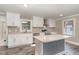 Bright kitchen with stainless steel appliances, an island, and white cabinets at 328 Cleveland St, Rocky Mount, NC 27803