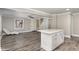 Open-concept living space connecting to the kitchen, with stylish gray floors and neutral wall colors at 328 Cleveland St, Rocky Mount, NC 27803