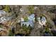 Aerial view of neighborhood featuring the home's backyard pool, gray roof and circular driveway at 330 Tenney Circle, Chapel Hill, NC 27514