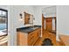 Bathroom features a wood vanity with dark countertop, modern fixtures, and access to the closet at 330 Tenney Circle, Chapel Hill, NC 27514