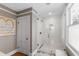 Bathroom with a frameless glass shower with white subway tile and patterned wallpaper at 330 Tenney Circle, Chapel Hill, NC 27514