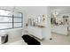 Luxurious bathroom with a freestanding tub, white vanity with modern light fixture, and sleek design at 330 Tenney Circle, Chapel Hill, NC 27514