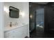 Contemporary bathroom featuring a stylish mirror, vanity with sink, and a glass-enclosed shower at 330 Tenney Circle, Chapel Hill, NC 27514