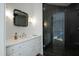 Modern bathroom with sleek vanity, decorative mirror and glass-enclosed shower at 330 Tenney Circle, Chapel Hill, NC 27514