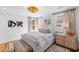 Inviting bedroom with white walls, hardwood floors, and a luxurious upholstered bed and custom nightstand at 330 Tenney Circle, Chapel Hill, NC 27514