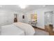 Bright bedroom boasts white walls, recessed lighting, and an ensuite bathroom with glass enclosed shower at 330 Tenney Circle, Chapel Hill, NC 27514