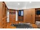 Spacious walk-in closet with custom built-in shelving and zebra-print rug on hardwood flooring at 330 Tenney Circle, Chapel Hill, NC 27514