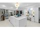 Large custom closet with island, vanity, and plenty of cabinets, drawers and shelving space with marble floors at 330 Tenney Circle, Chapel Hill, NC 27514