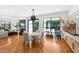 Stylish dining area with modern lighting, ample natural light, and wood floors at 330 Tenney Circle, Chapel Hill, NC 27514