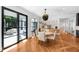 Bright dining area features a modern light fixture and large windows to the backyard at 330 Tenney Circle, Chapel Hill, NC 27514